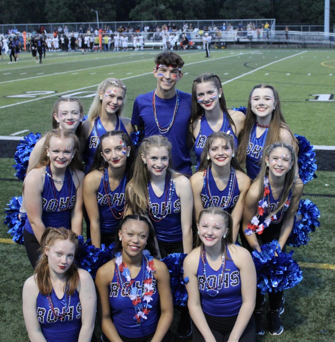 The team gathers for a photo after a performance at a  football home game against Ferndale.