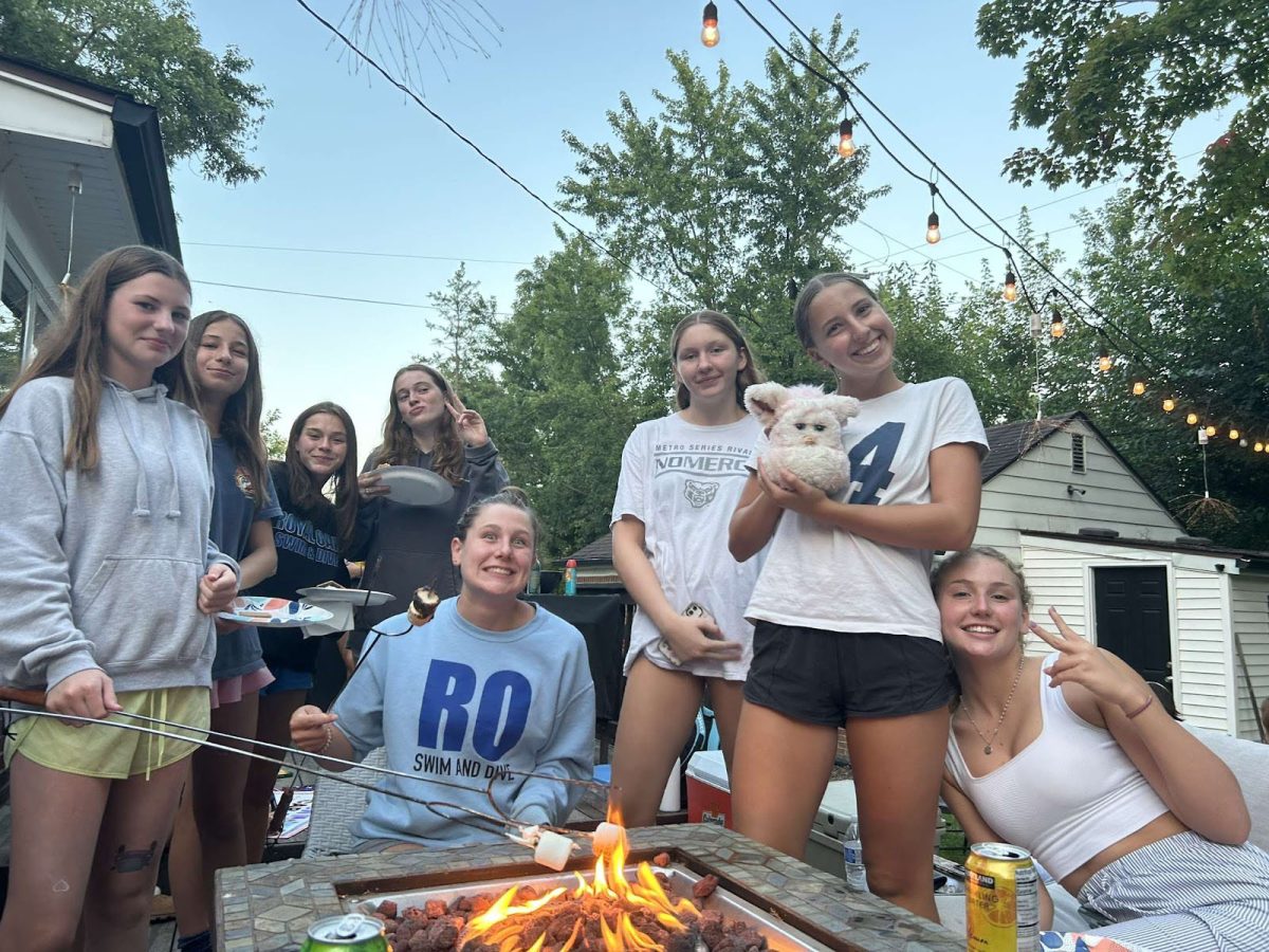 Kate Groya, Charlotte Worcester, Sophia Benda, Marlyn  Toy, Elsie Winterburn, Kamryn Eberhardt, Maren Kuban  and Molly Truesdell enjoy time together at a group bonfire. 
Photo contributed by Mira Tarraf.