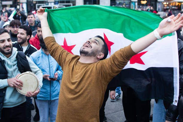 Syrians parade in the streets of cologne after hearing Damascus is liberated.
(Free domain, getty images)